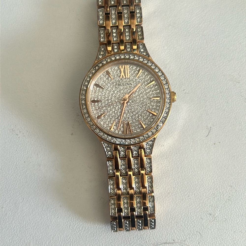 Bulova womans watch cz diamonds and I have addition links  have the box also